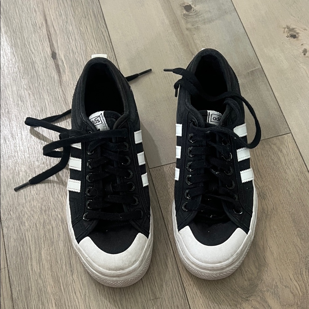 Adidas women’s Black and White Striped Sneakers
